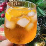 Aperol spritz in front of a Christmas tree