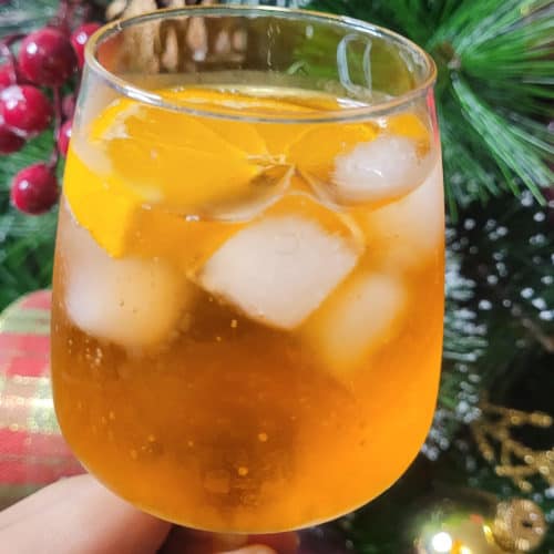 Aperol spritz in front of a Christmas tree