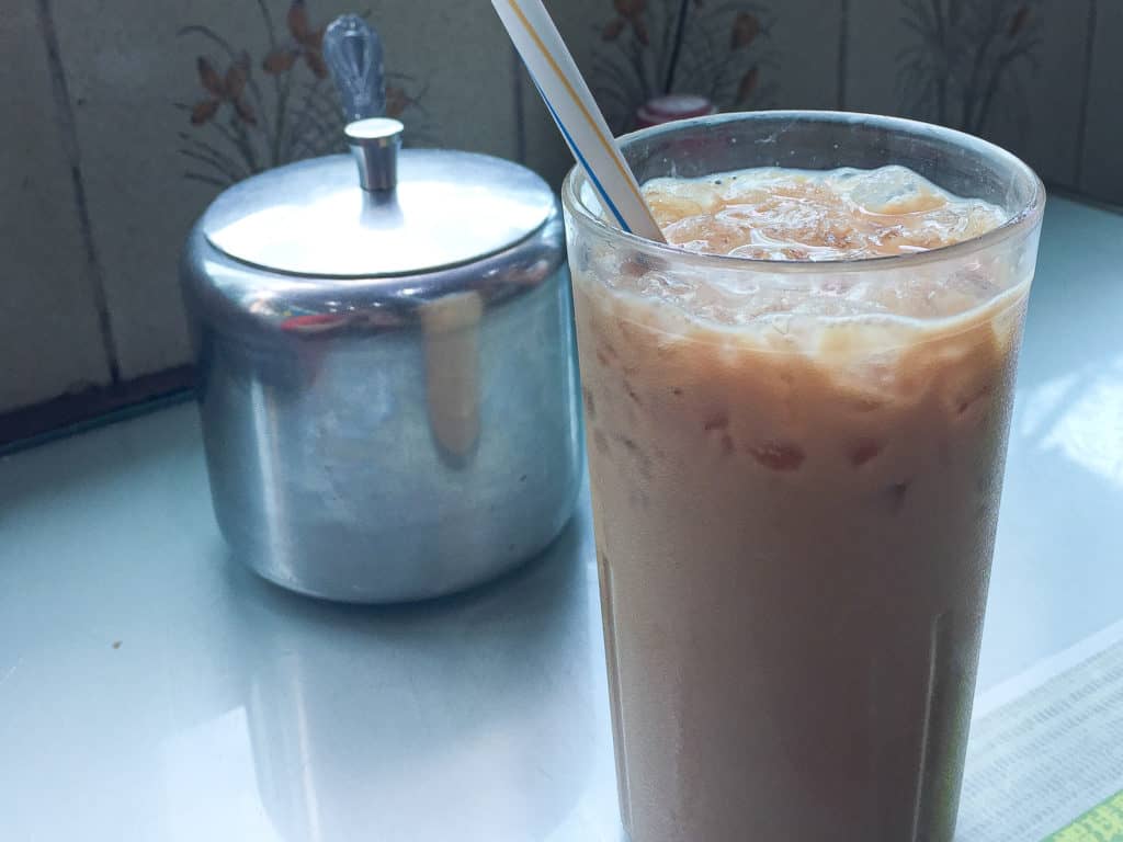 iced milk tea with tin of sugar at Mido Cafe in Hong Kong