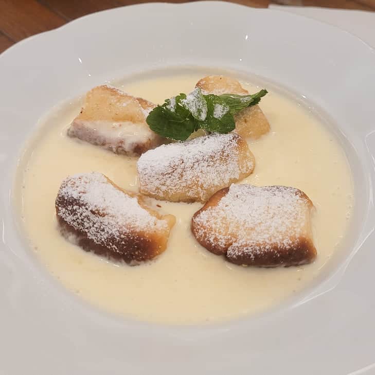 Czech sweet buns with vanilla cream topped with powdered sugar