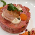 Beef tartare with sauce and vegetables