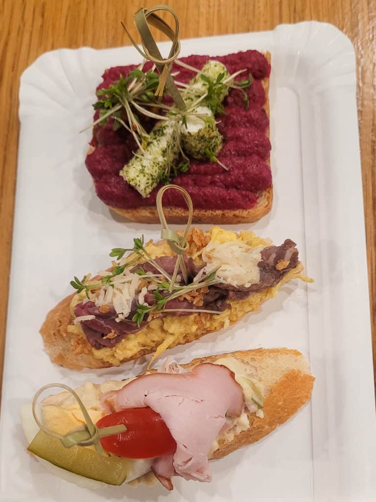 Overhead shot of open-faced sandwiches on a table
