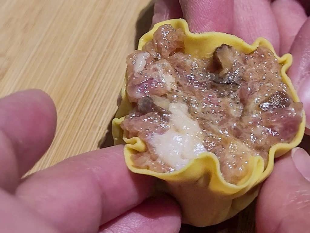 Siu mai being wrapped