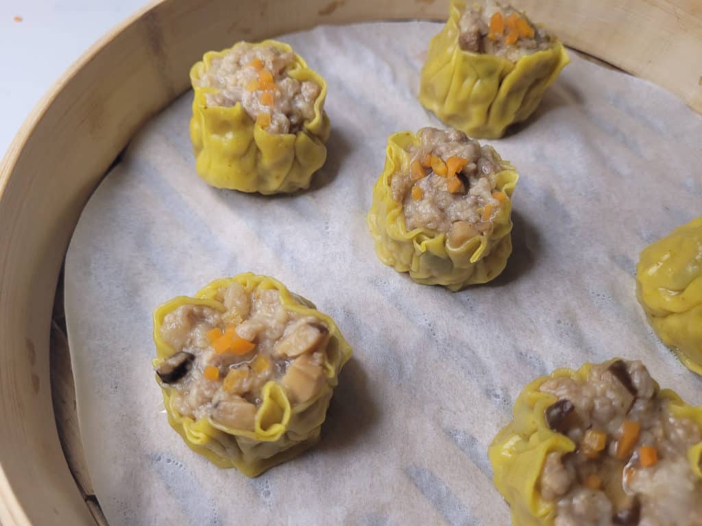 Siu mai in a bamboo steamer