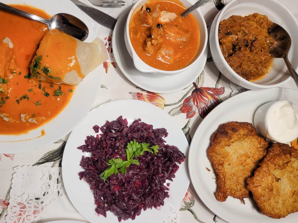 A spread of Polish dishes in a restaurant on a white table