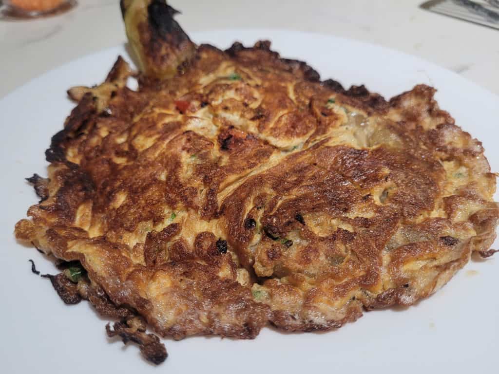 Closeup of a fried tortang talong on a plate