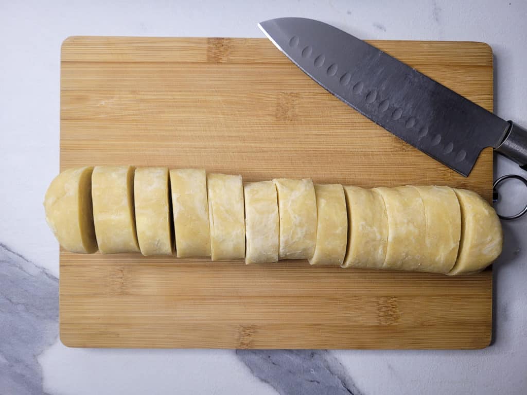 Pastry dough log cut into twelve pieces