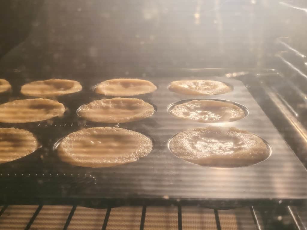 Muffins baking in an oven