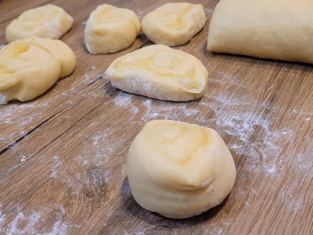 Closeup of rolled and slice otap pieces on wooden table