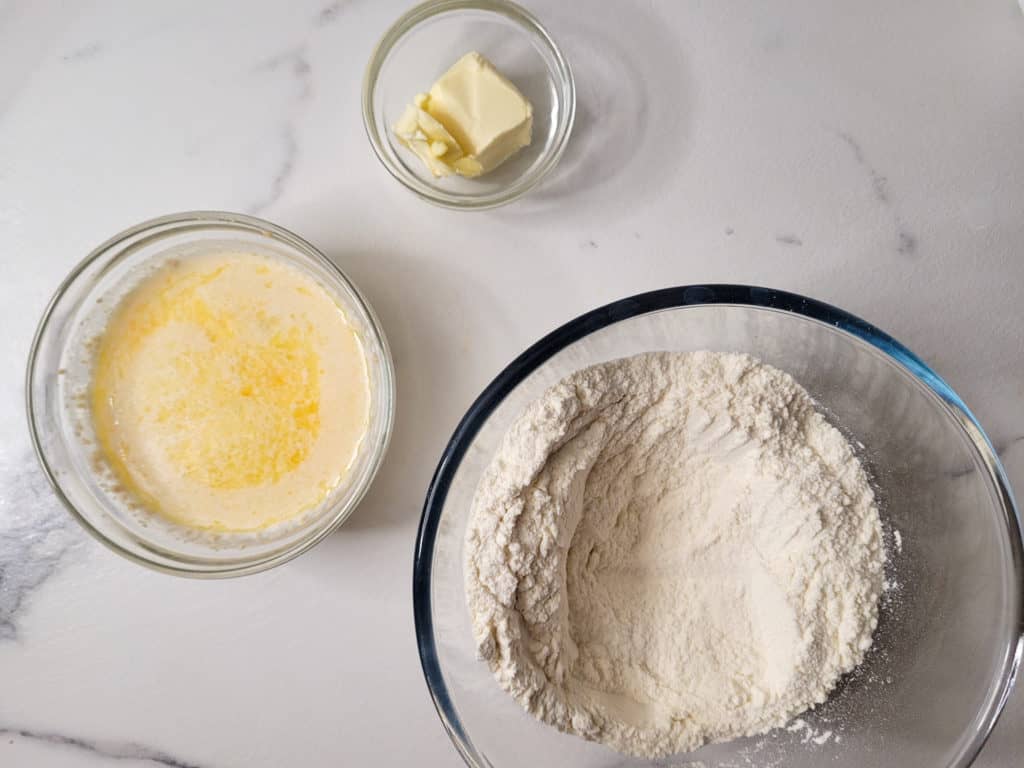 Clear bowls with otap ingredients on a marble countertop