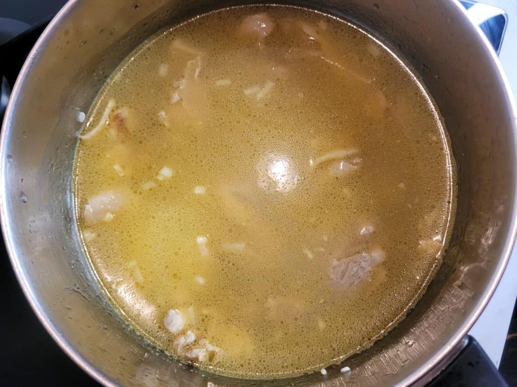 Arroz caldo with water in a pot