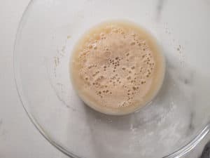 Yeast mixture in the process of blooming in a bowl