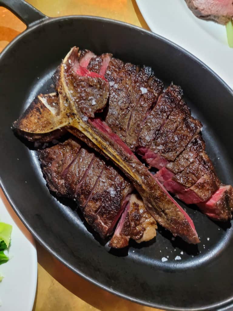 Porterhouse steak in a skillet at Hawkmoor London