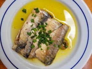 Sardines in olive oil on a plate