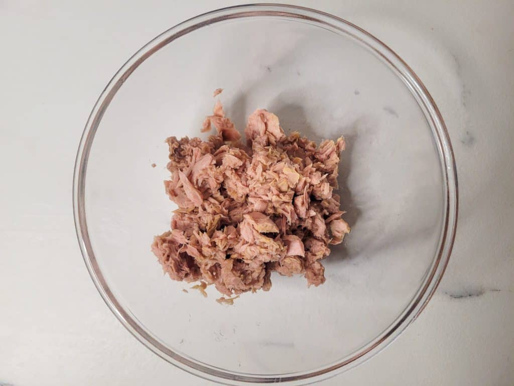 Canned tuna meat inside a clear bowl