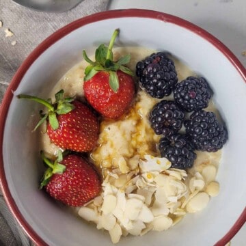 Closeup of oatmeal custard with fruits and almonds