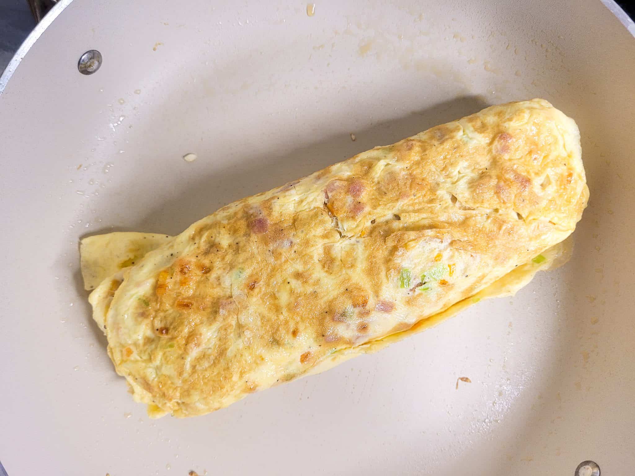 Gyeran mari or rolled egg omelet in a pan