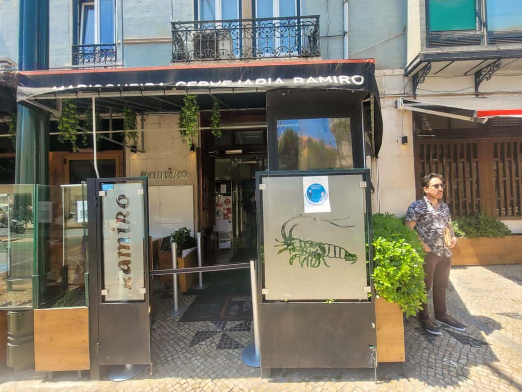 Man standing next to Cervejaria Ramiro