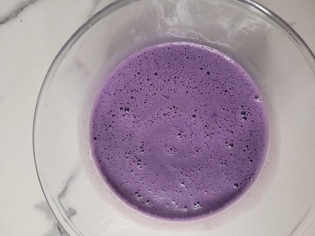 A bowl with purple ube pot de creme custard