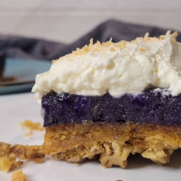 Ube crunch cake close up with whipped cream