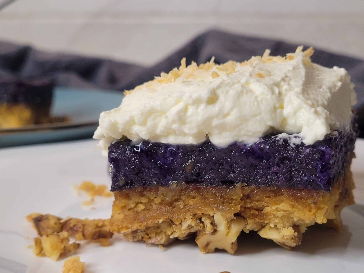 Ube crunch cake close up with whipped cream