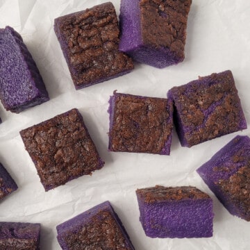Ube butter mochi squares of different sizes