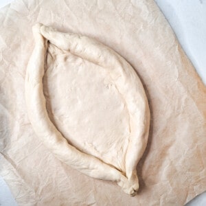 A dough shaped to look like a canoe, for a bread called Adjarian khachapuri