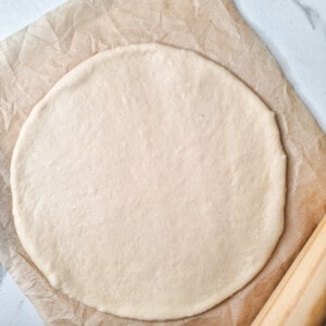 Raw dough rolled out to look like a circle