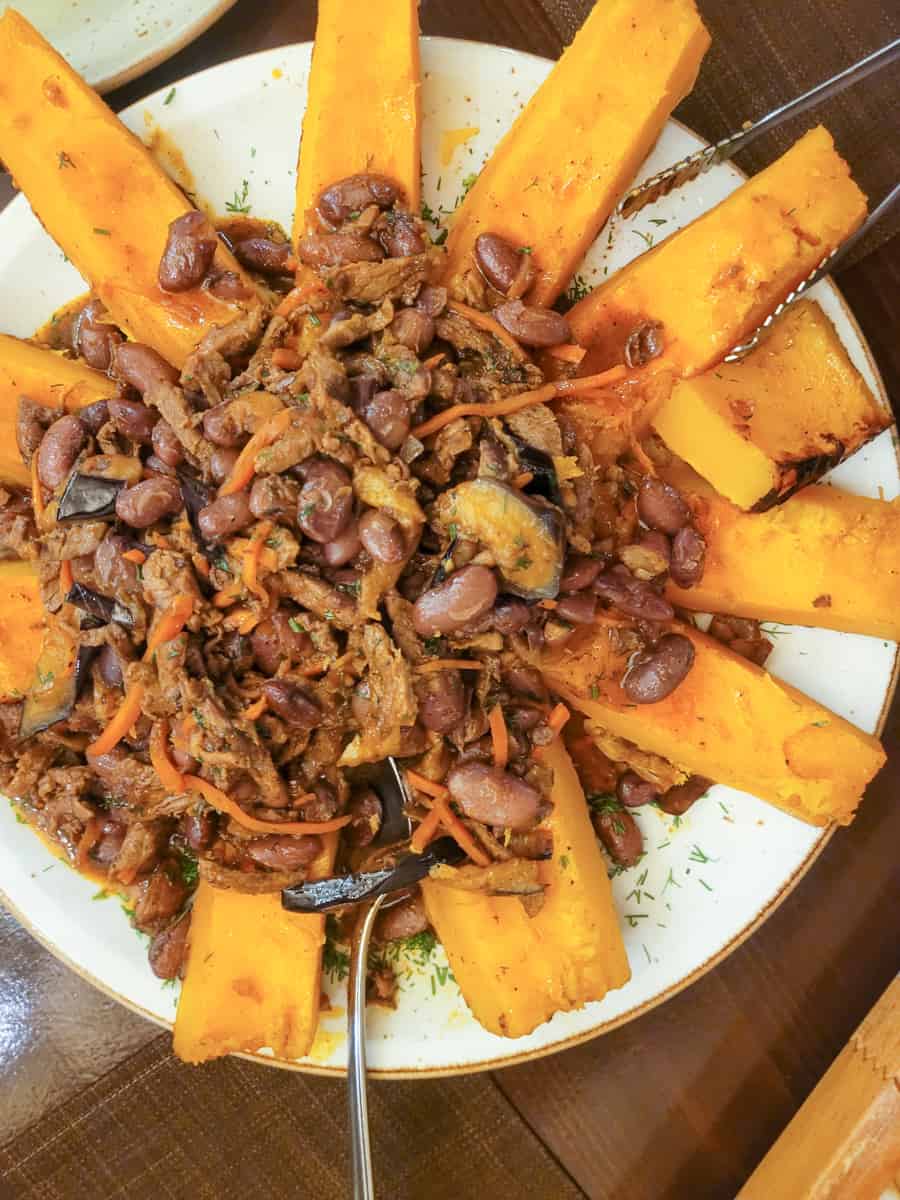 Slices of pumpkin with meat toppings in Yerevan