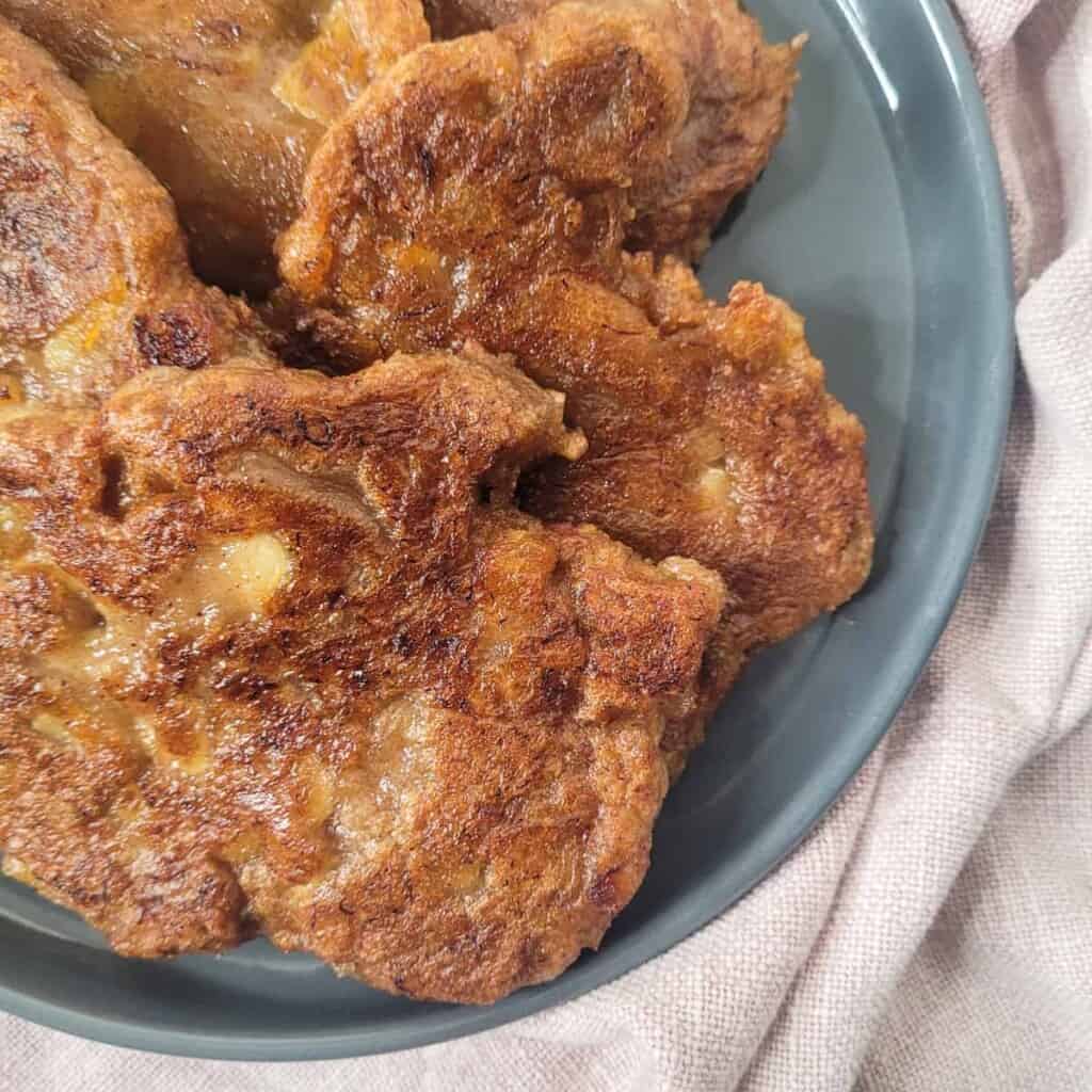 Banana fritters closeup on a gray plate