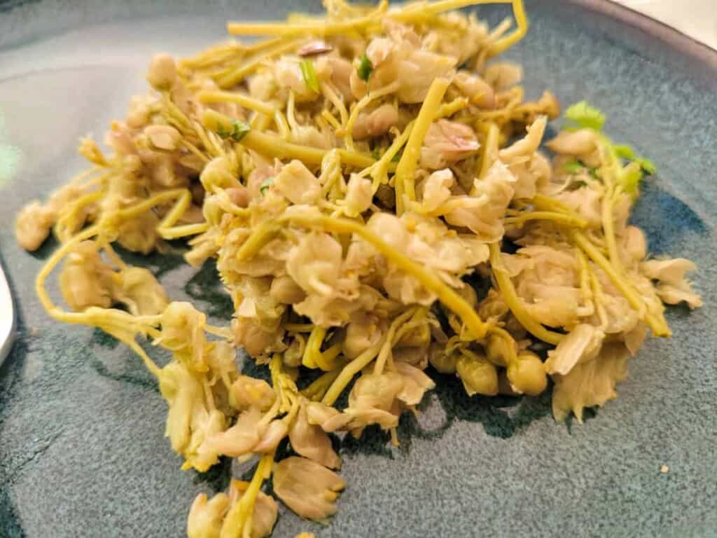 Marinated sprouts on a blue plate