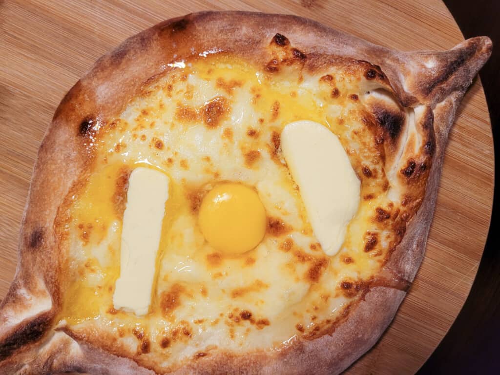 Adjarian khachapuri on a white plate