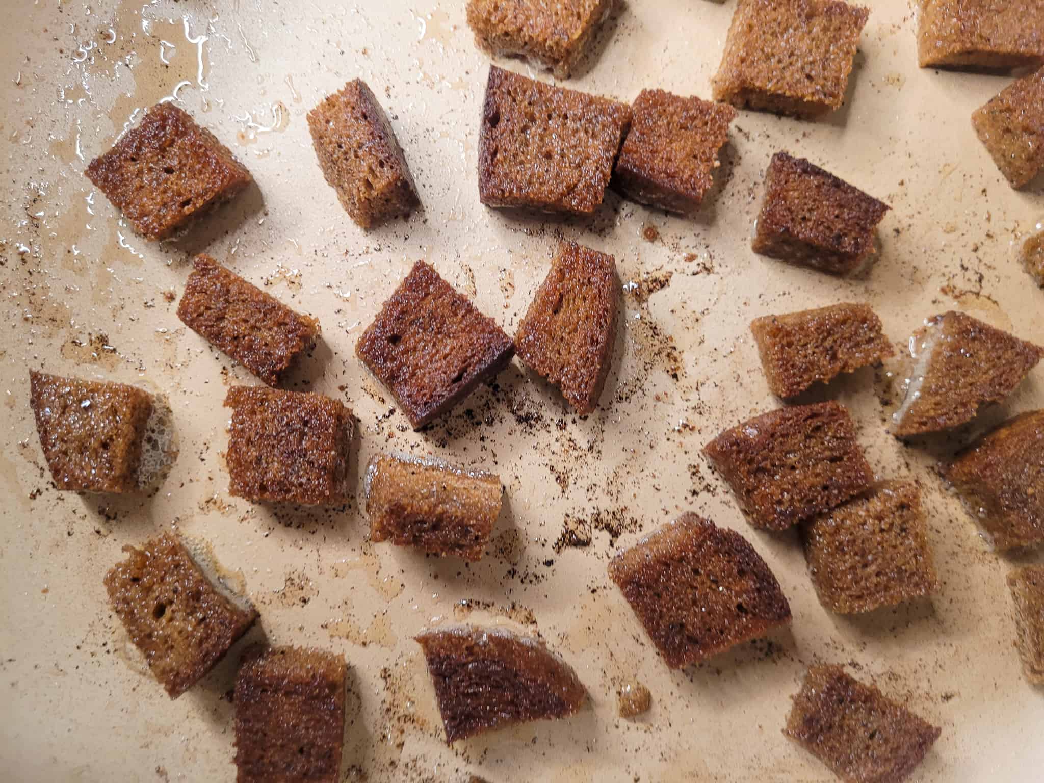 Pieces of brown crouton in a pan