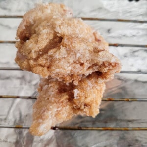Closeup of a fried chicken on a wire rack