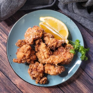A blue plate with Japanese fried chicken or chicken karaage