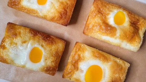 Overhead view of gyeran ppang or Korean egg bread on parchment paper