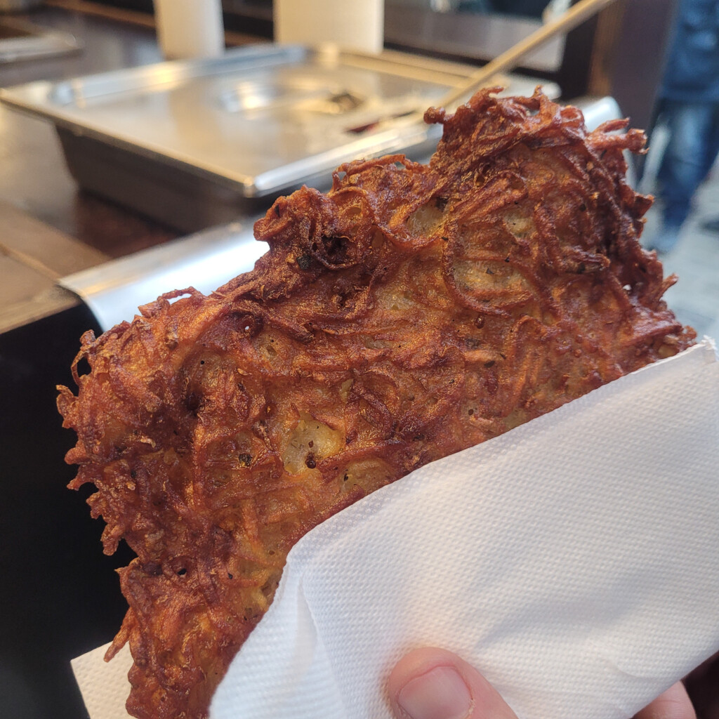 Closeup of fried potato pancake, Christmas market food in Vienna