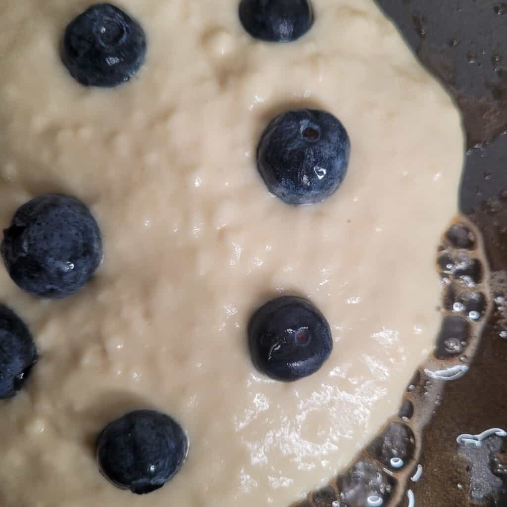 Closeup of blueberry pancake batter with blueberries