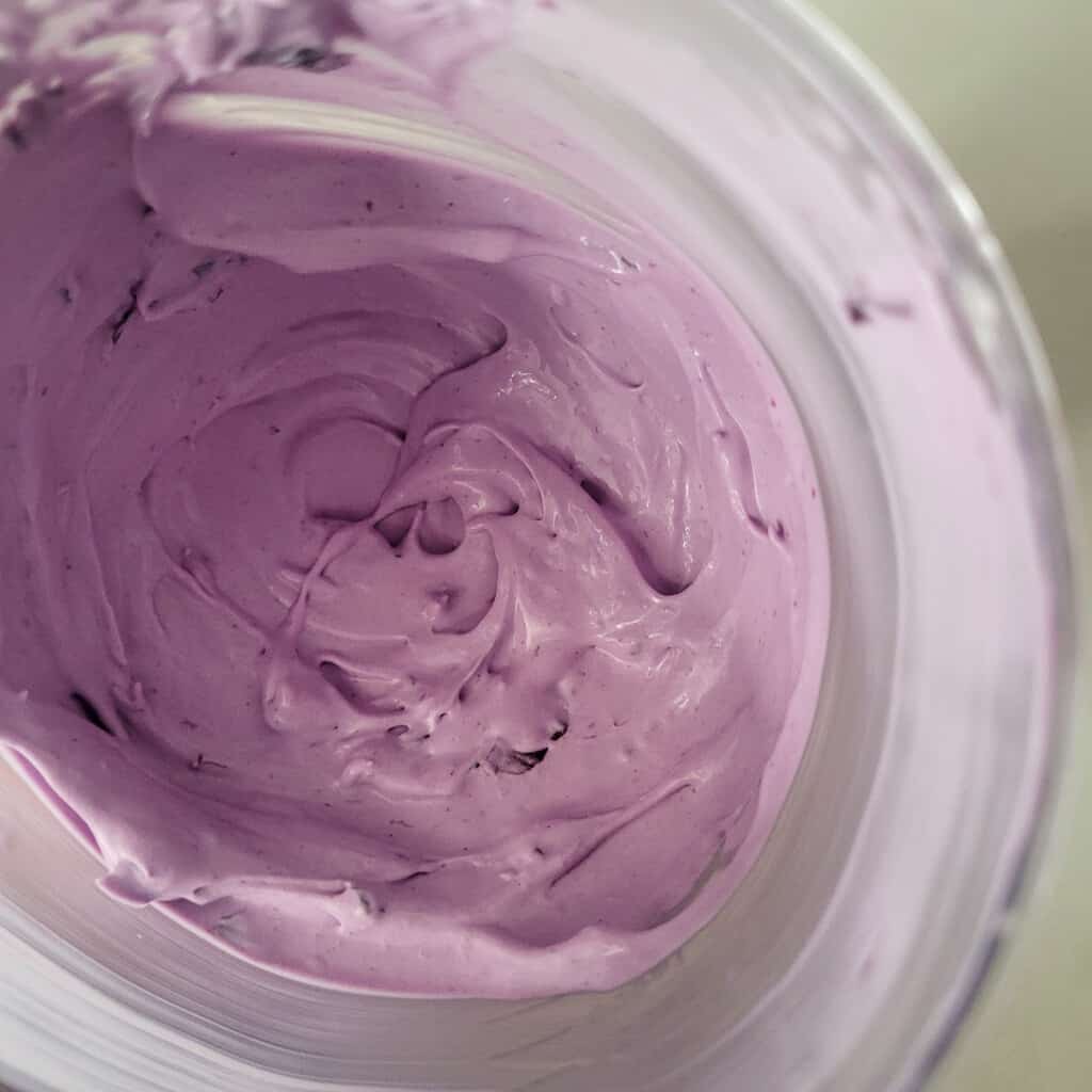 Whipped blueberry cream in a bowl