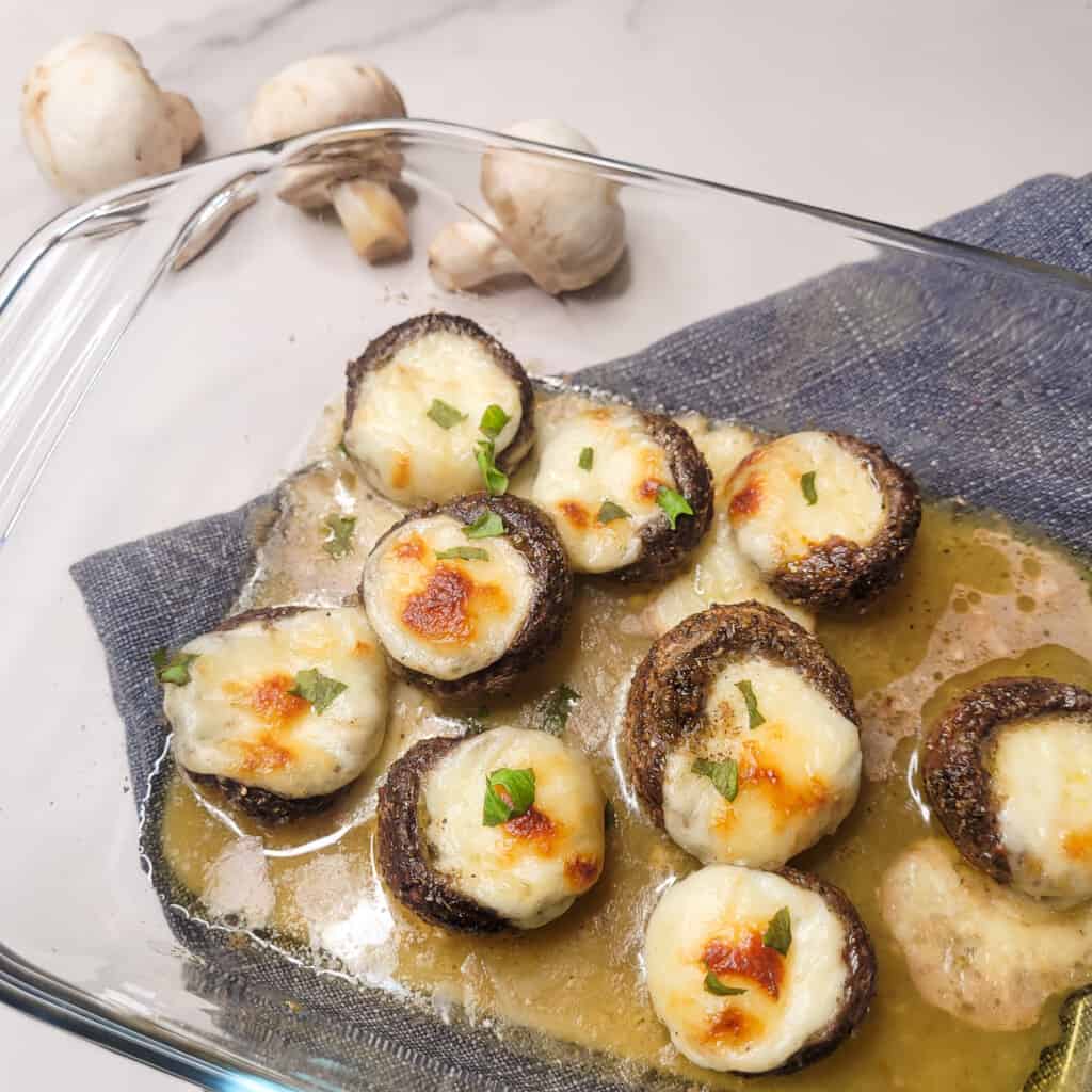 Soko kecze or cheese stuffed mushrooms in a pan