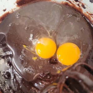 Eggs in mocha brownie mixture in bowl