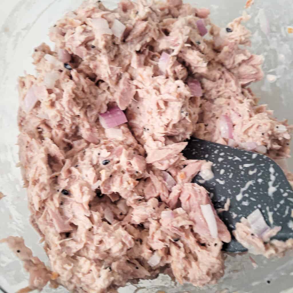 Bowl filled with tuna for onigirazu mixed with mayonnaise