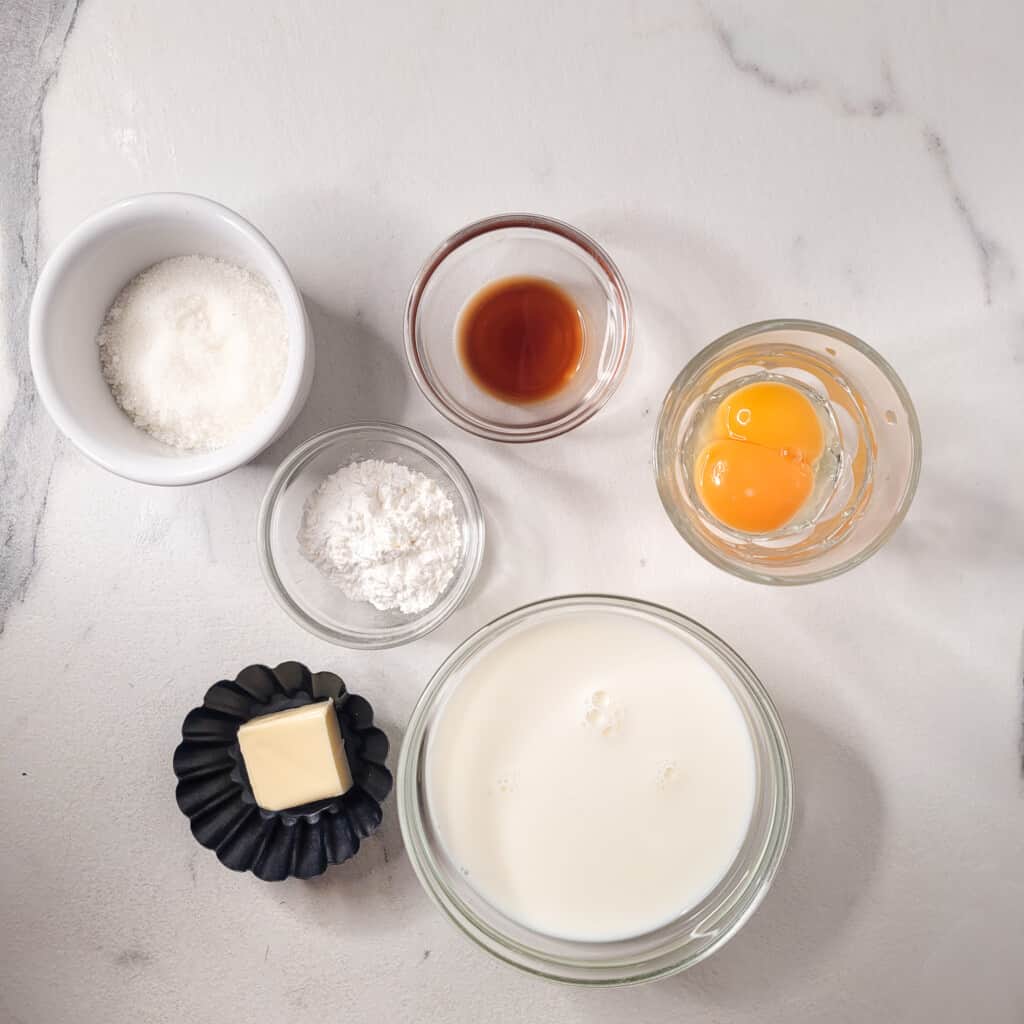 Ingredients for custard for strawberry with custard pie.