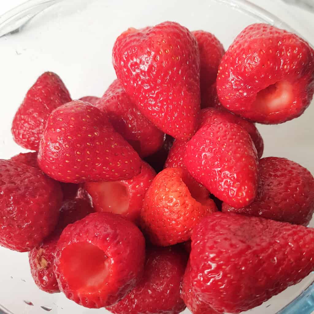 A bowl of hulled strawberries.