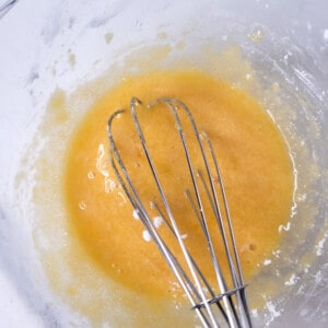 Mixed custard ingredients in a bowl.