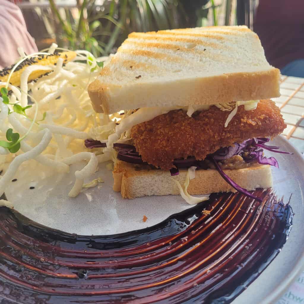View of a fried katsu sandwich from the side