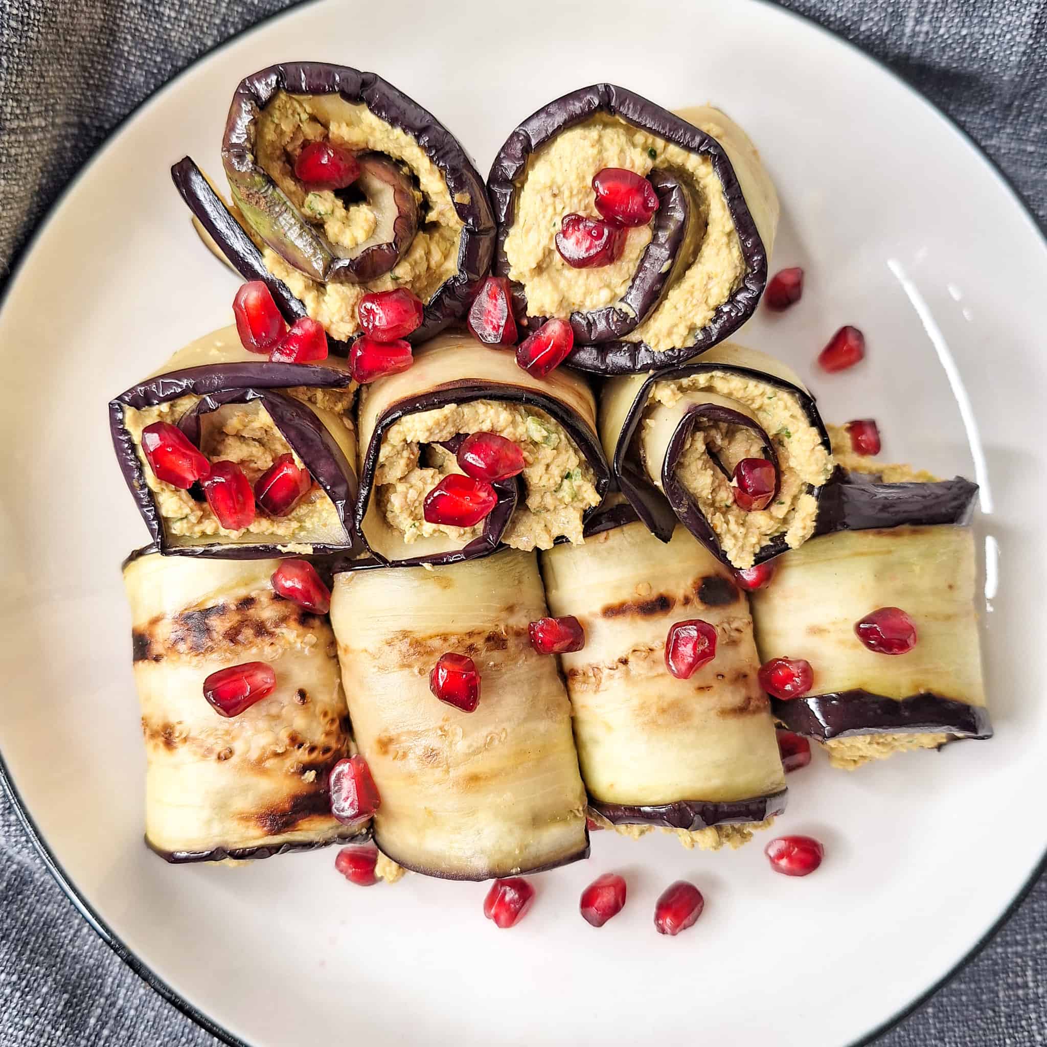 Plate filled with Georgian eggplant roll or badrijani nigvzit