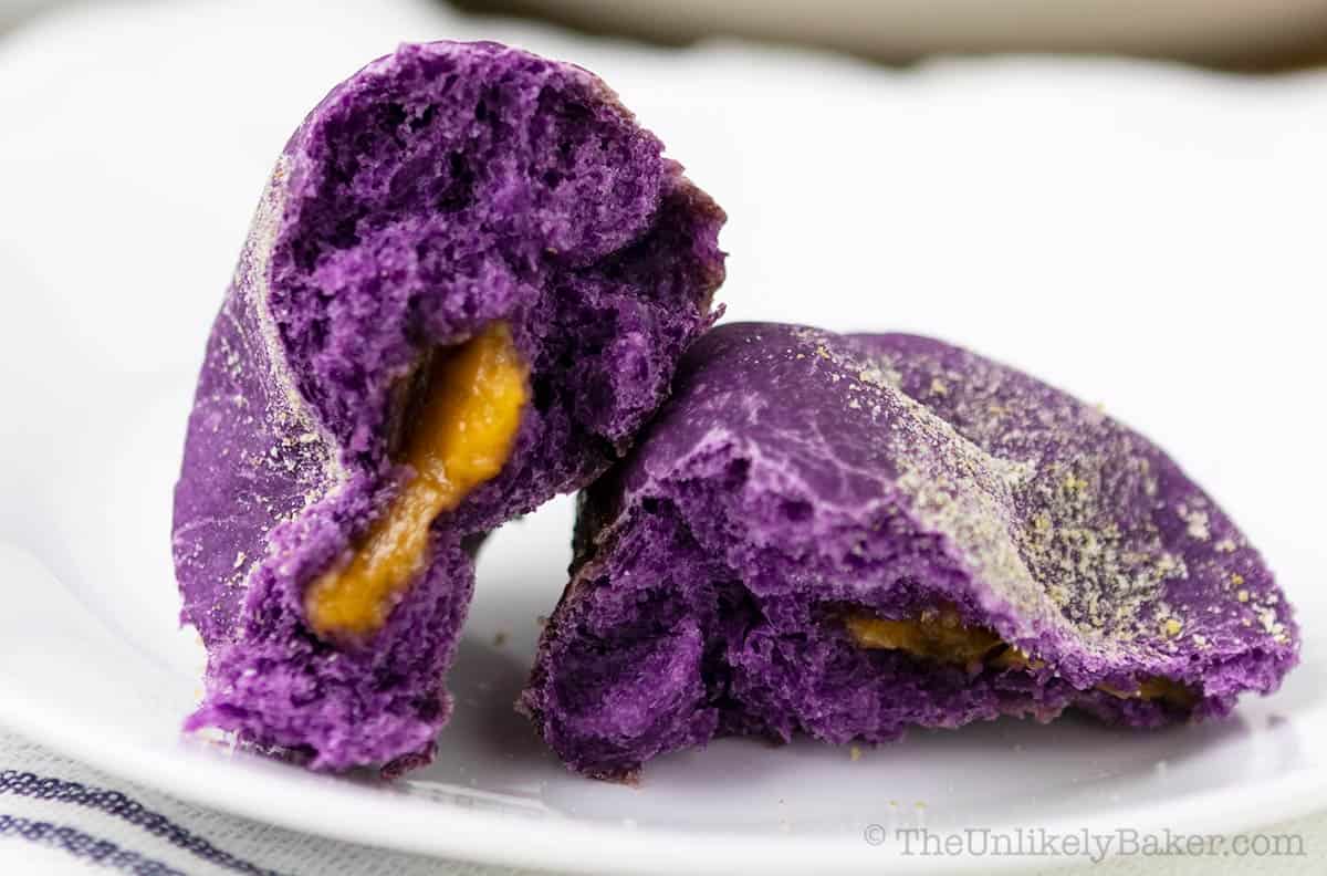 Cross-section of ube pandesal or bread rolls with cheese filling