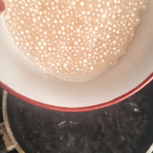Pour parboiled tapioca balls into boiling water
